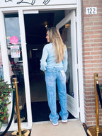 Lichtblauwe Top met Opengewerkte Structuur en Kartelrand